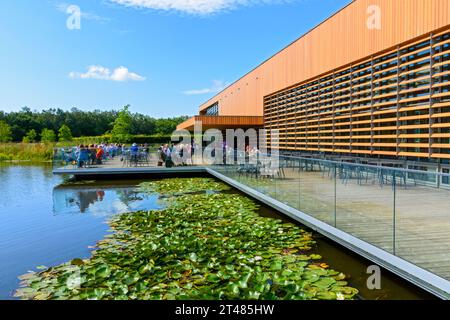 The Welcome Building over the Moon Bridge Water lake, RHS Bridgewater gardens, Worsley, Salford, Greater Manchester, UK Stock Photo