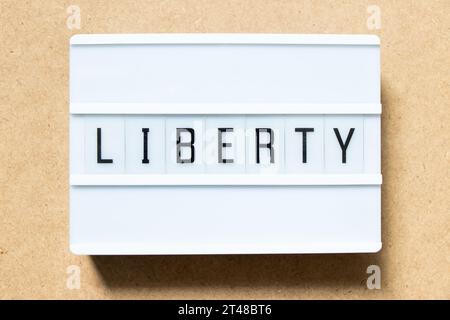 Lightbox with word liberty on wood background Stock Photo