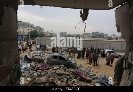 Gaza. 29th Oct, 2023. People are seen among the rubble of buildings destroyed in Israeli airstrikes in the southern Gaza Strip city of Rafah, Oct. 29, 2023. The death toll of Palestinians from Israeli strikes on the Gaza Strip rose to 8,005, including 3,342 children, the Hamas-run Health Ministry said on Sunday. So far, more than 20,000 Palestinians have been injured since the fighting broke out, the ministry said in a statement. Credit: Khaled Omar/Xinhua/Alamy Live News Stock Photo