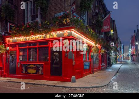 The Temple Bar Pub is a traditional Irish pub in Dublin, Ireland, famous for its live music, lively atmosphere, and iconic whiskey selection. Stock Photo