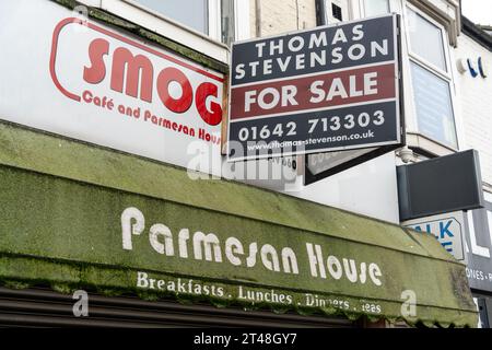 A closed down restaurant Smoggies Parmesan House in Middlesbrough, UK has green moss growing on its canopy. Concept of the death of the high street Stock Photo