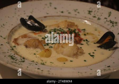 Waterzooi (chicken stew in cream), Belgian local food, at a restaurant in Bruges, Belgium Stock Photo