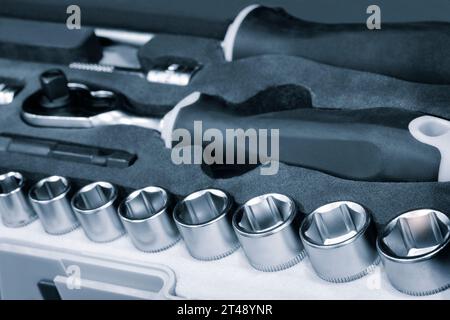 Hardware toolkit with many different garage equipment. Automobile fix background. Screwdriver metal bits set Stock Photo