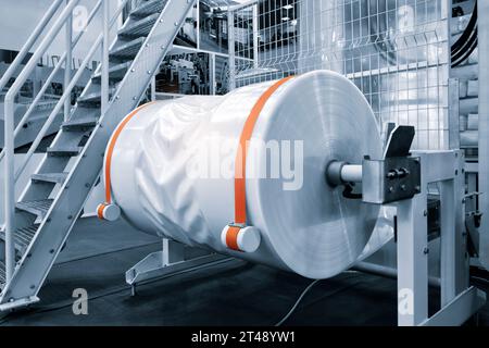 industrial packaging plant with polyelene reel for automatic packaging of pallets for delivery Stock Photo