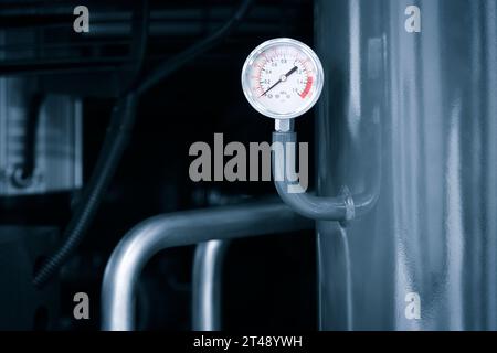 air conditioner technician using manifold gauge checking refrigerant for filling home air conditioning and air duct cleaning and maintenance outdoor c Stock Photo