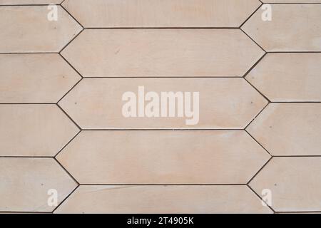 The texture of beige marble is used for interior and exterior ceramic tiles for walls and floors. Hexagonal tiles. High quality photo Stock Photo