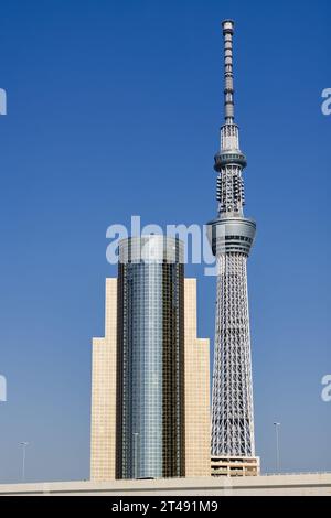 Tokyo, Japan - April 09, 2023: Sumida skyline in Tokyo. To see are the Sumida City Office with the Tokyo skytree Stock Photo