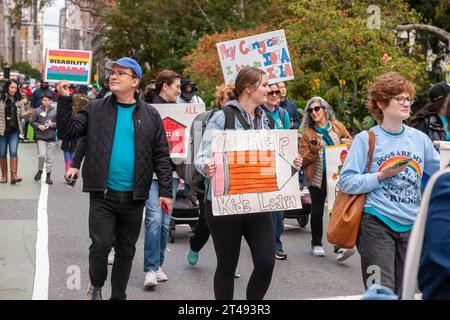 People with disabilities and their supporters march from Madison Square Park in New York for the Disability Pride Parade on Sunday, October 22, 2023 celebrating the Americans With Disabilities Act (ADA).  The ADA ensured accessibility to the disabled and removed barriers to employment, transportation, public accommodations, public services and telecommunications. (© Richard B. Levine) Stock Photo