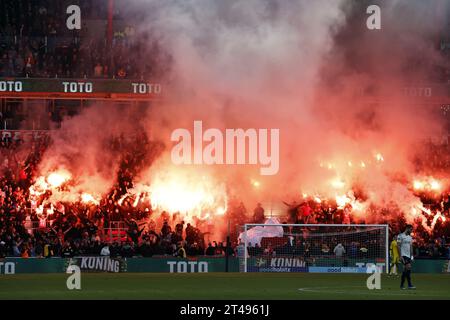 EINDHOVEN - PSV supporters set off fireworks during the Dutch Eredivisie match between PSV Eindhoven and Ajax Amsterdam at the Phillips stadium on October 29, 2023 in Eindhoven, Netherlands. ANP MAURICE VAN STEEN Stock Photo