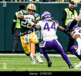 Green Bay, United States. 29th Oct, 2023. Green Bay Packers running back AJ Dillon (L) runs on Minnesota Vikings safety Josh Metellus (R) during the NFL game between the Minnesota Vikings and the Green Bay Packers at Lambeau Field on Sunday, October 29, 2023, Photo by Tannen Maury/UPI Credit: UPI/Alamy Live News Stock Photo