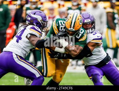 Green Bay, United States. 29th Oct, 2023. Green Bay Packers running back AJ Dillon (C) runs the ball on Minnesota Vikings safety Josh Metellus (L) ad Minnesota Vikings linebacker Jordan Hicks (R) during the NFL game between the Minnesota Vikings and the Green Bay Packers at Lambeau Field on Sunday, October 29, 2023, Photo by Tannen Maury/UPI Credit: UPI/Alamy Live News Stock Photo