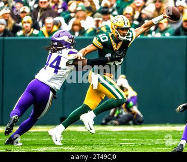 Green Bay, United States. 29th Oct, 2023. Green Bay Packers quarterback Jordan Love (R) scrambles to get away from Minnesota Vikings safety Josh Metellus (L) during the NFL game between the Minnesota Vikings and the Green Bay Packers at Lambeau Field on Sunday, October 29, 2023, Photo by Tannen Maury/UPI Credit: UPI/Alamy Live News Stock Photo