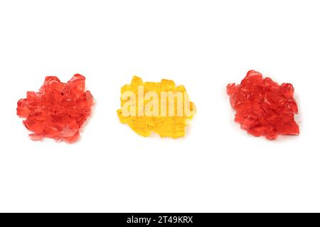 Sweet fruit jelly dessert isolated on a white background. Gelatin cubes. Stock Photo