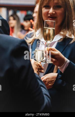 Triumphant Business Team Celebrating Achievements at a Vibrant Corporate Party Stock Photo