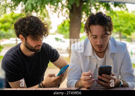 Multicultural Students Engaged in Collaborative Discussion on University Campus Yard Stock Photo