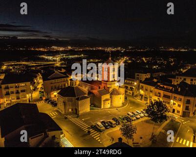 Aerial view of the town and the Romanesque church of Santa Eugènia de Berga at night, in Plana de Vic (Osona, Barcelona, Catalonia, Spain) Stock Photo