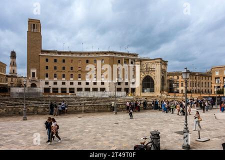 The main piazza in the old town of Lecce, Italy with the Roman amphitheatre whose existence was rediscovered in 1901. A very popular tourist spot. Stock Photo