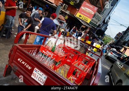 Ciudad del Este, Paraguay - July 27, 2022: Coca-cola delivery truck parked in a corner of the commercial area of the city Stock Photo