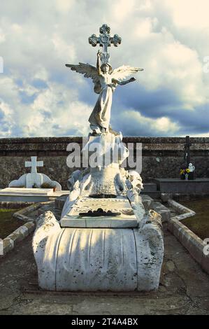 A heavenly sentinel in Comillas Cemetery, guiding souls with grace towards the heavens Stock Photo