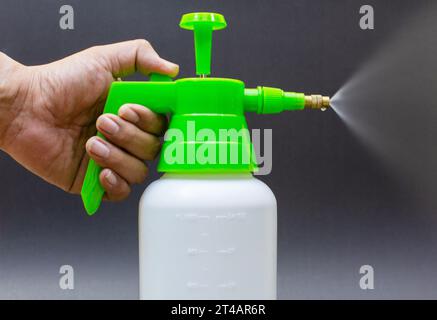The pressure washer is in hand. lonely on a black background Stock Photo