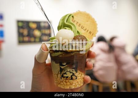 Close up take away plastic cup of Japanese tradition Matcha green tea ice cream Stock Photo