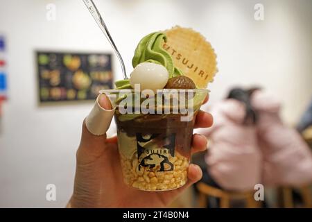 Close up take away plastic cup of Japanese tradition Matcha green tea ice cream Stock Photo