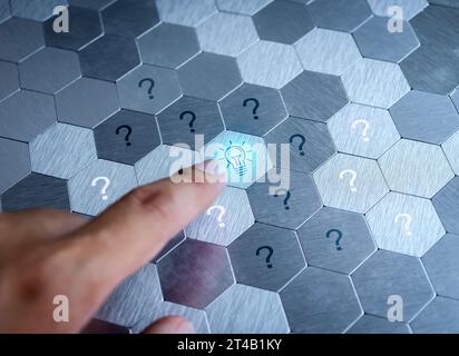 Solution, business solve, innovative idea inspiration from digital network online technology concepts. Light bulb icon button pressing by hand with ma Stock Photo