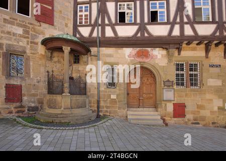 House facade with historic draw well, house door, window, Kessler champagne cellar, former Speyr Pfleghof, Esslingen, Baden-Wuerttemberg, Germany Stock Photo