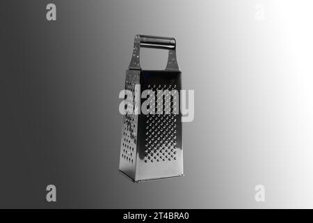 Manual vegetable grater. Close-up. Isolated on a gray background. Stock Photo