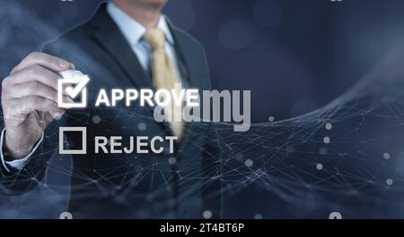 Businessman writing or tick correct mark to approve. check electronic documents on digital documents and checklist approval, online evaluation of busi Stock Photo