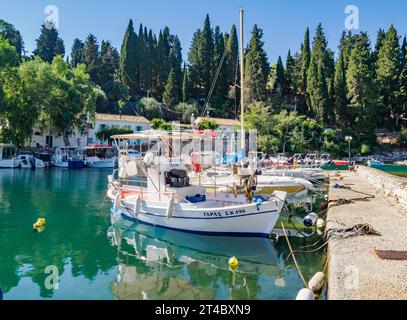 The pretty little fishing harbour of Kouloura on the north-east coast of Corfu in the Ionian Islands of Greece Stock Photo