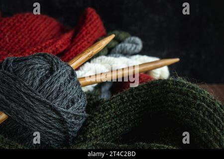 Knitting needles and skeins of colorful wool yarn. Stock Photo