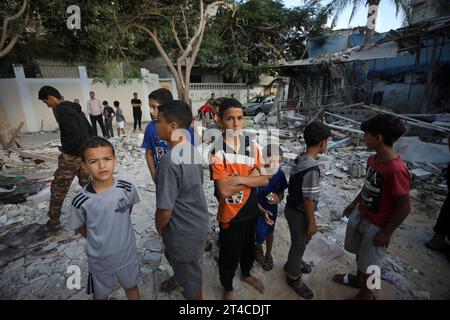 Rafah, Gaza. 29th Oct, 2023. Palestinians boys stand through rubble of the Kurd family house that were destroyed during Israeli air raids in Rafah the southern Gaza Strip on Monday, on October 30, 2023, Israeli strike continuing on Gaza smidst severe Siege, The Palestinian Ministry of Health said that more than 8000 Palestinians have been killed in Gaza in Israeli attacks since October 7, including about 4000, children and about 2000, women. Photo by Ismael Mohamad/UPI. Credit: UPI/Alamy Live News Stock Photo