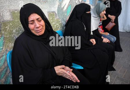Rafah, Gaza. 29th Oct, 2023. Palestinian relatives of the eight members of the Kurd family killed in an Israeli airstrike, wait to collect the bodies of the family for burial from the Najjar Hospital, in Rafah in the southern Gaza on Monday, on October 30, 2023, Israeli strike continuing on Gaza smidst severe Siege, The Palestinian Ministry of Health said that more than 8000 Palestinians have been killed in Gaza in Israeli attacks since October 7, including about 4000, children and about 2000, women. Photo by Ismael Mohamad/UPI. Credit: UPI/Alamy Live News Stock Photo
