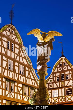 gabled half-timbered houses with St. Michael's Fountain on the medieval market square in the evening, Germany, Rhineland-Palatinate, Bernkastel-Kues Stock Photo