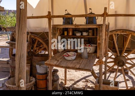 The chuck box or kitchen box of a covered wagon camp at the Bluff Fort Historic Site in Bluff, Utah. Stock Photo