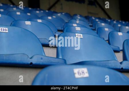 Empty blue seats in a football stadium Stock Photo