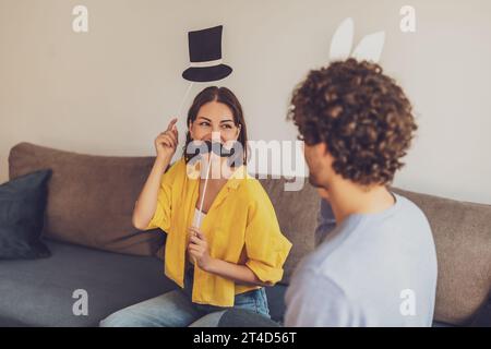 Portrait of young happy couple at home. They are having fun. Stock Photo