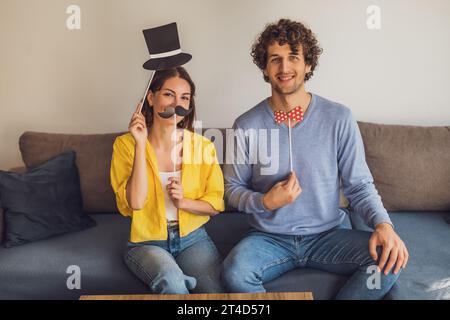 Portrait of young happy couple at home. They are having fun. Stock Photo