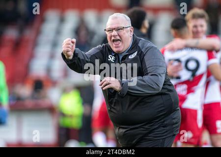 Football manager Steve Evans animated and cheering after winning game whilst head coach at Stevenage Football Club Stock Photo