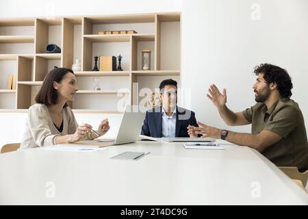 Multiethnic business partners working on in meeting room together Stock Photo