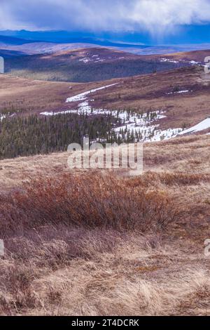 Snow on mountain and hill sides, viewed from the 'Top of the World Highway' or Yukon Highway 9. Highway between Dawson City and Alaska. Stock Photo