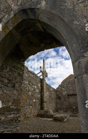 The ruined medieval Ray Church in Donegal, Ireland, renowned for its 8th-century high cross, tallest medieval stone cross in Ireland, and tranquil set Stock Photo