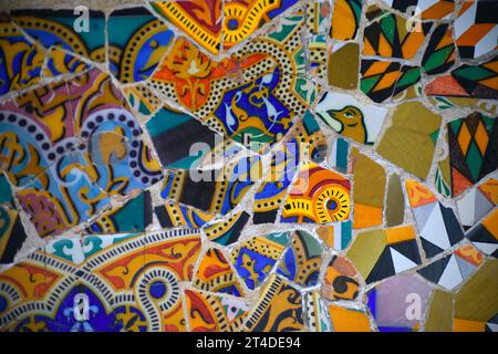 Trencadís mosaic at bench in Park Güell by architect Antoni Gaudí in Barcelona, Spain Stock Photo