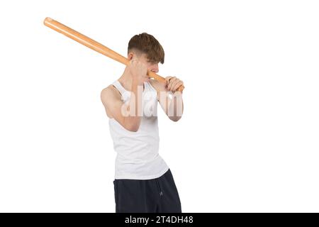 A caucasian teeanage boy holding baseball bat about to swing Stock Photo