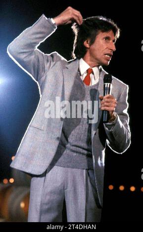 DAVID BRENNER (February 4, 1936 - March 15, 2014) was an American stand-up comedian, actor and author ; The most frequent guest on The Tonight Show Starring Johnny Carson in the 1970s and 1980s, Brenner was a pioneer in the genre of observational comedy ;  PICTURED: Jun 1, 1983 - Comedian DAVID BRENNER on stage in 1983 ;  Credit: Lynn Mcafee / Performing Arts Images www.performingartsimages.com Stock Photo