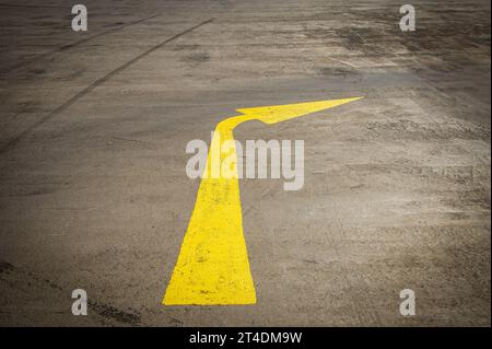 yellow arrow Turn right on the road Stock Photo