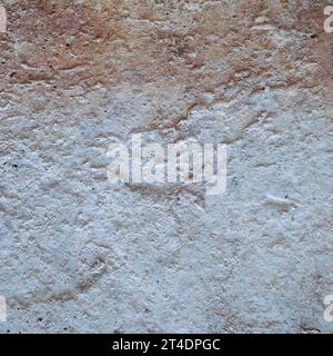 Old dirty cement wall with paint residues Stock Photo