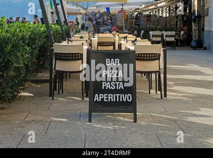 bar restaurant signboard stand in Piazza Cavour, Como, Italy Stock Photo