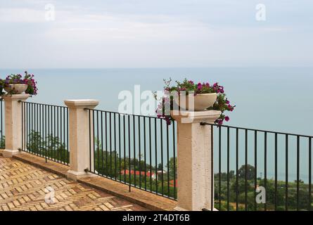 view of the Adriatic sea from a terrace with flowerpots in Vasto, Abruzzo, Italy Stock Photo